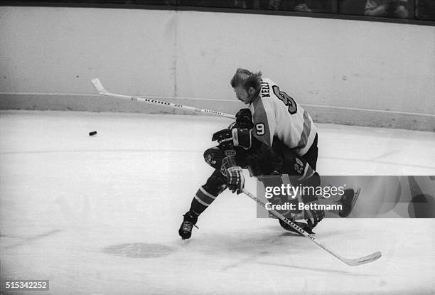 Philadelphia Flyers' Bob Kelly slams into New York Rangers' Doug Jarrett in the first period at the Spectrum in Philadelphia.