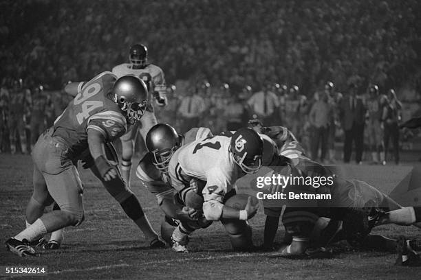 University of Oregon quarterback Dan Fouts scores a touchdown on a run from the eleven-yard-line in the first quarter against UCLA at the Coliseum.