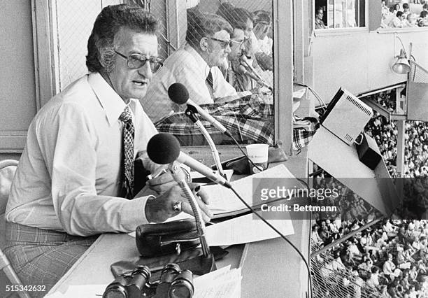 Bob Uecker play-by-play announcer for the Milwaukee Brewers radio team, is shown at work during the Red Sox-Brewers game at Fenway Park.