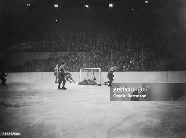 Goalie George Hainsworth blocks Seibert's slap at the net in a game with the Rangers.