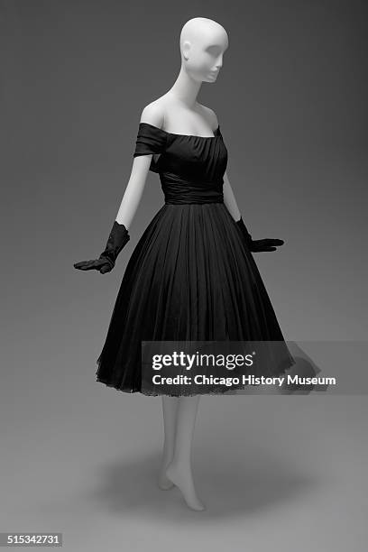 Black chiffon cocktail dress, designed by James Galanos and distributed by Blum's Vogue, Chicago, Illinois, 1958. Shown as part of the Chicago...