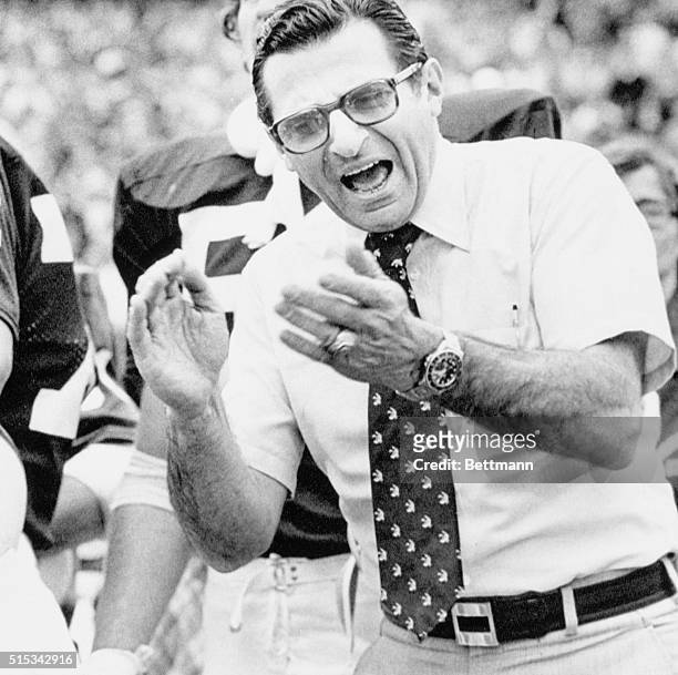 Penn State coach Joe Paterno applauds his team after a touchdown by the Nittany Lions during first half of seventh annual Fiesta Bowl against Arizona...