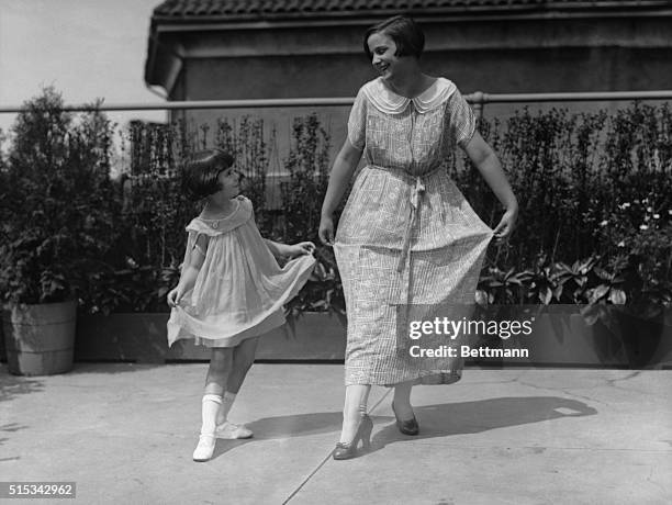 Baby Peggy Montgomery dancing with a women, circa 1925.