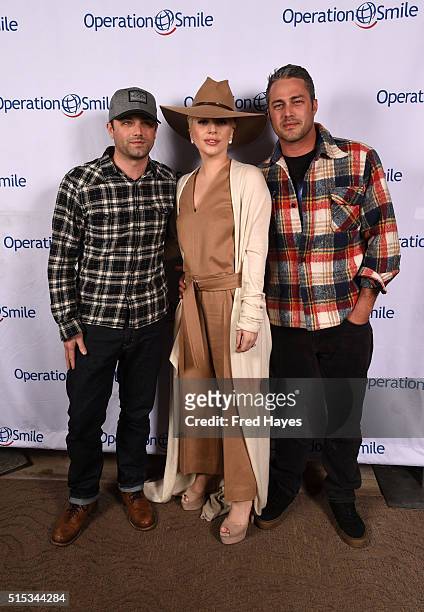 Trent Kinney, Lady Gaga and Taylor Kinney pose at Tupelo on March 12, 2016 in Park City, Utah.