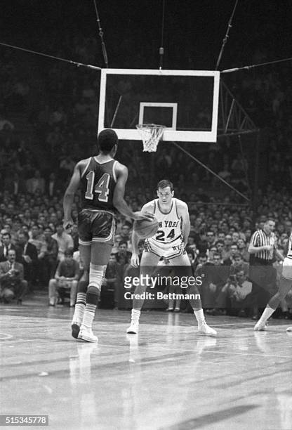 Bill Bradley, newest New York Knicks' player, faces Eddie Miles of the Detroit Pistons, in his professional basketball debut here at Madison Square...
