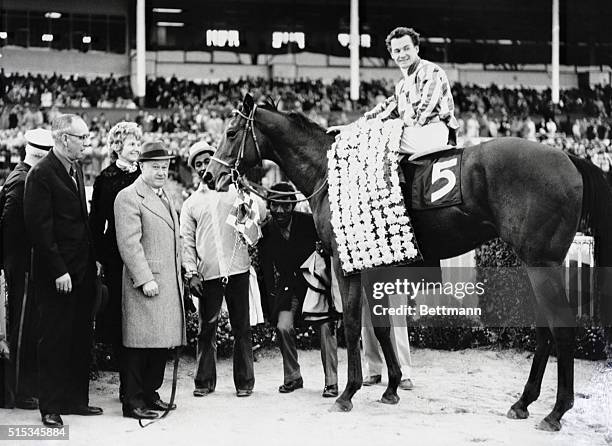 Riva Ridge with jockey Ron Turcotte in the saddle, pictured in the winner's circle at Garden State Park after annexing top honors in the $293 Garden...