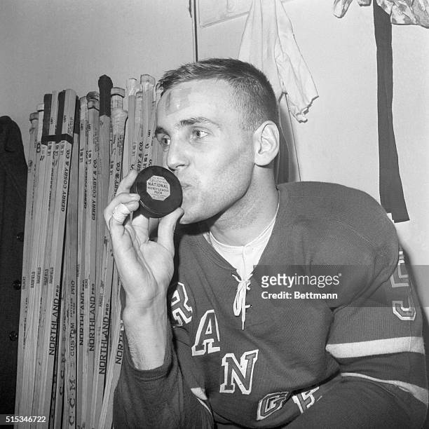 Sweden's Ulf Sterner, the first European-bred player to play in the National Hockey League, kissing a puck in the New York Rangers' dressing room...