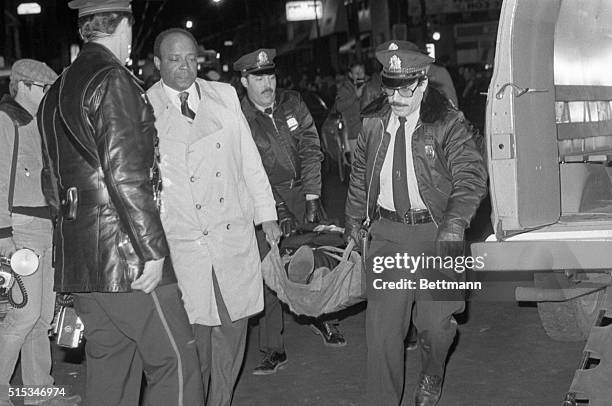 Philadelphia police carry away the body of Angelo Bruno from his house in Philadelphia. He was shot to death in his car in front of his home. Bruno...