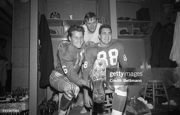 Giant halfback Frank Gifford lends a hand as Pat Summerall displays the foot that did the trick for the New Yorkers, after the game against the...