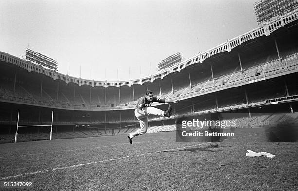 Pat Summerall, place kicker for the New York Giants, limbers up his kicking tee during practice at Yankee Stadium here Oct. 25th. Summerall found...