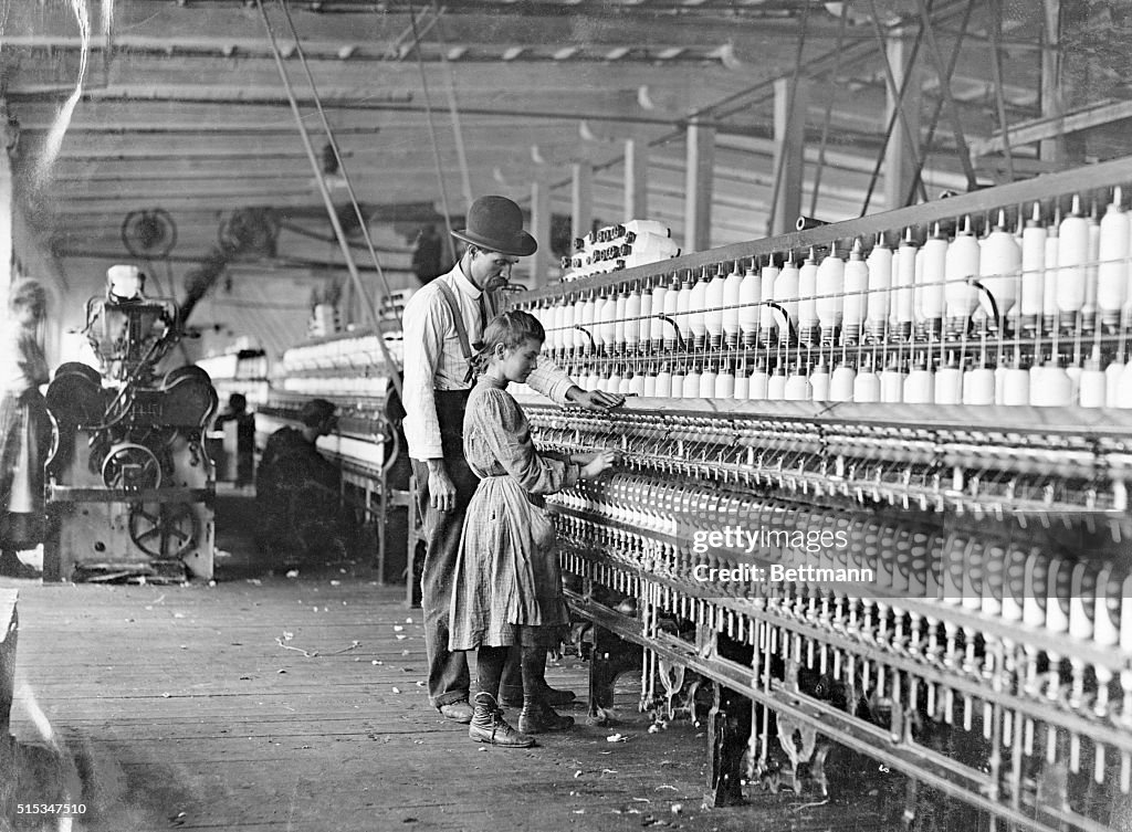 Girl Working At Factory Being Instructed