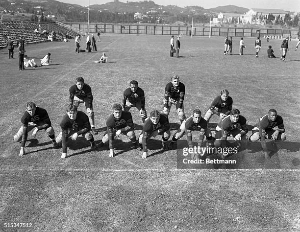 The first string football team of the University of California, at Lost Angeles, during their recent first workout of the season. The line, , Frank...