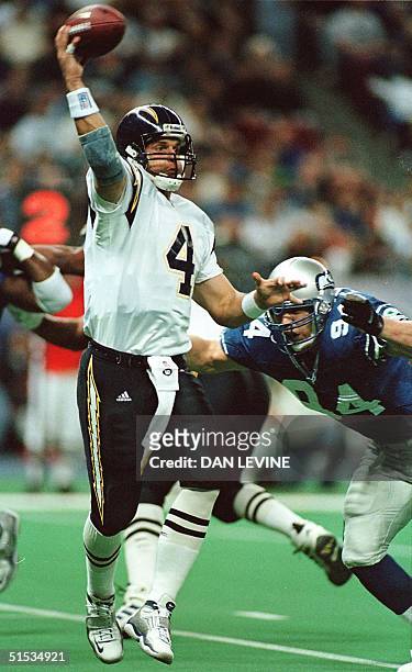 Seattle Seahawk Chad Brown pressures San Diego Charger quarterback Jim Harbaugh during first quarter action 12 December 1999 in Seattle, WA. San...