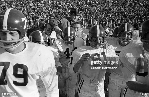 Jubilant University of Alabama football team carries their proud coach off the field after winning the Sugar Bowl classic 12-7. Coach Paul ‘Bear'...