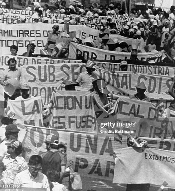 Leftist union members and relatives of political prisoners march in downtown San Salvador. Despite threats from the army not to permit the...