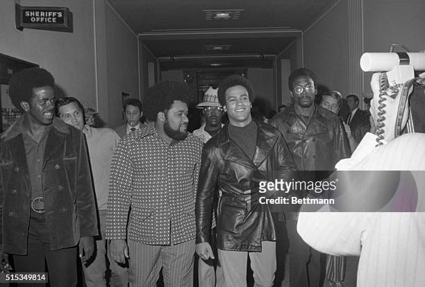 Black Panther chief, Huey Newton is escorted by his bodyguard, Robert Bay as they arrive at court for Newton's third manslaughter trial. Newton's...