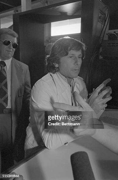 Movie director Roman Polanski receives instructions at the desk as he checks in at the California Men's Institute at Chino 12/16. Polanski reported...