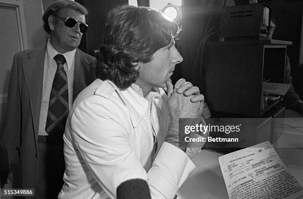 Movie director Roman Polanski waits at the desk after arriving at the California Men's Institute at Chino 12/16. Polanski, who pleaded guilty to...