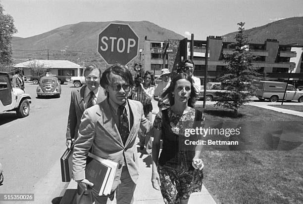 Actress-singer Claudine Longet , is escorted by unidentified attorney , as she leaves Pitkin County Courthouse. Miss Longet charged with 4th degree...