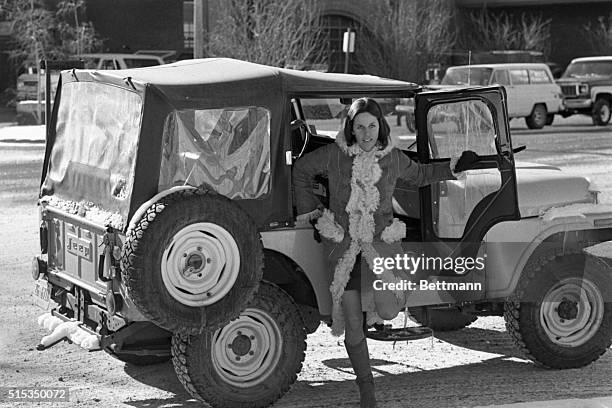 Singer-actress Claudine Longet jumps out of a friend's jeep as she returns to the Pitkin county Court House from lunch here Jan. 6. Miss Longet is on...