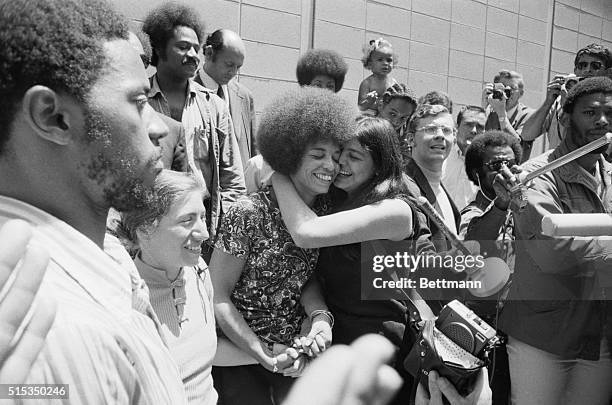 San Jose, CA- An exuberant Angela Davis is kissed by her friend Victoria Machado after Miss Davis was aquitted of all charges against her by an...