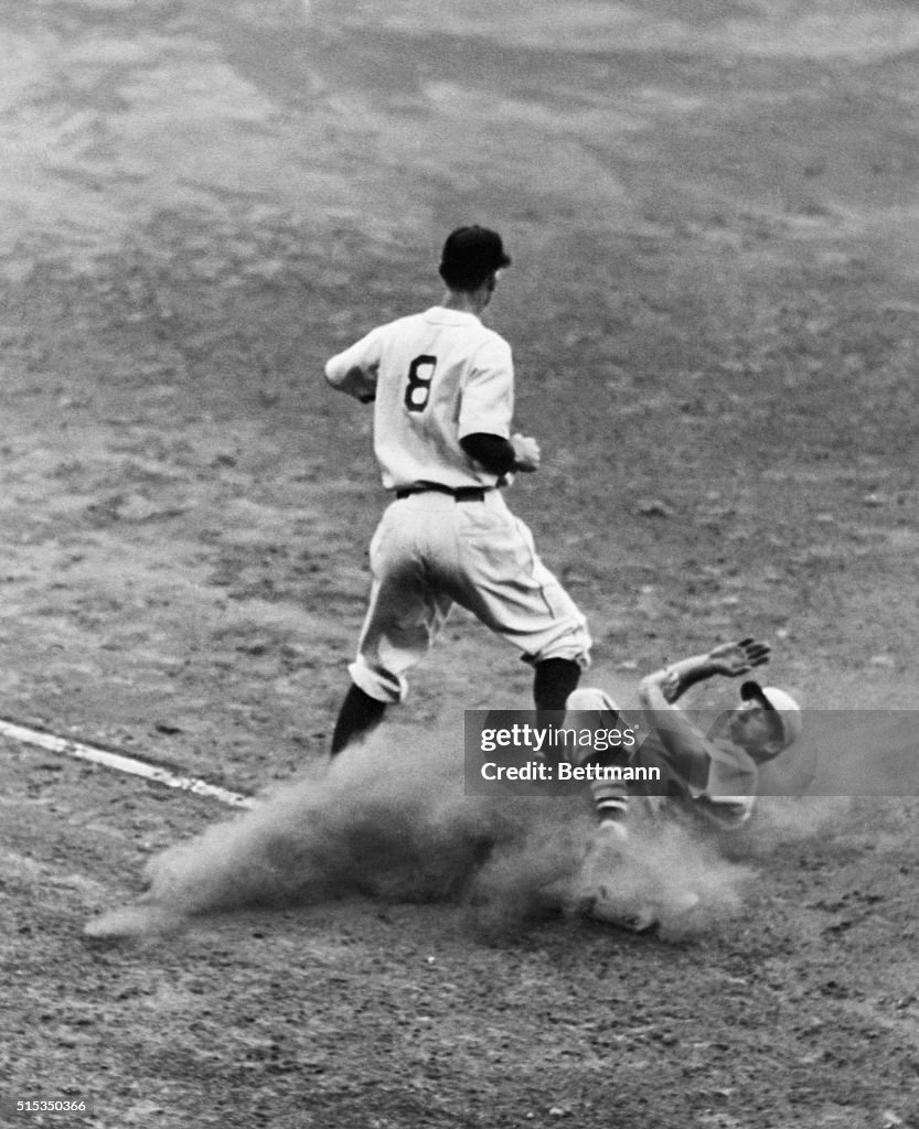 Third Baseman Stepping On Sliding Player