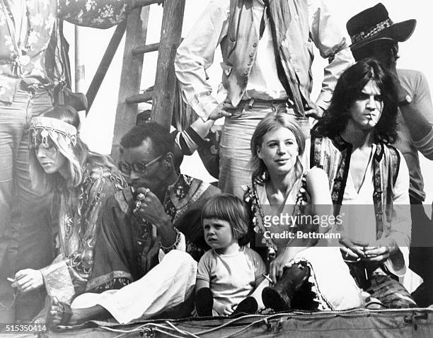 Actresses Anita Pallenberg and Marianne Faithfull , with her son Nicholas, are among the fans atop the Rolling Stones platform during the open air,...