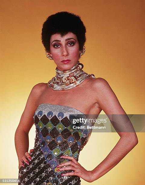 New York, NY: Singer Cher Bono in costume for her TV show, "The Sonny and Cher Comedy Hour." She is pictured here wearing a beaded dress and heavy...