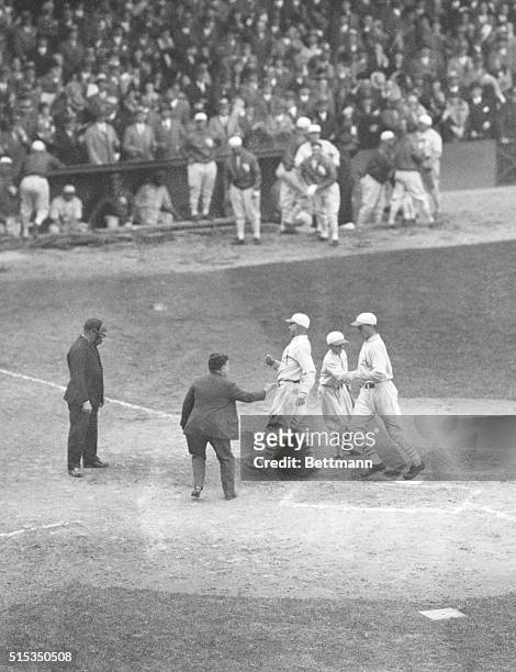 Bat boy greets Max Bishop and Mule Haas following Haas' ninth-inning home run in Game 5 of the 1929 World Series at Snibe Park. Haas' ninth inning...