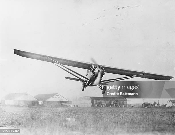 Airplane designed by G.M. Bellanca and piloted by Clarence Chamberlain and Bert Acosta takes off for a practice run from Roosevelt Field, Long...