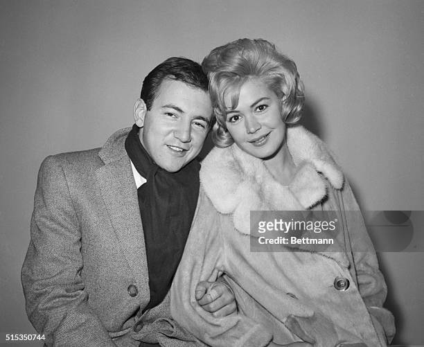 New York, NY- Singer Bobby Darin and actress Sandra Dee pose at Idlewild Airport, after their secret marriage earlier in Elizabeth, New Jersey. The...