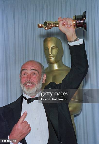 Actor Sean Connery Holds The Oscar He Won For Supporting Actor In The actor-sean-connery-holds-the-oscar-he-won-for-supporting-actor-in-the