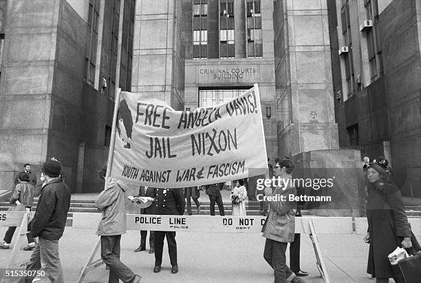 New York, NY: Demonstrators march in front of Criminal Court Dec. 3, prior to Angela Davis' extradition hearing on California murder charges. She was...