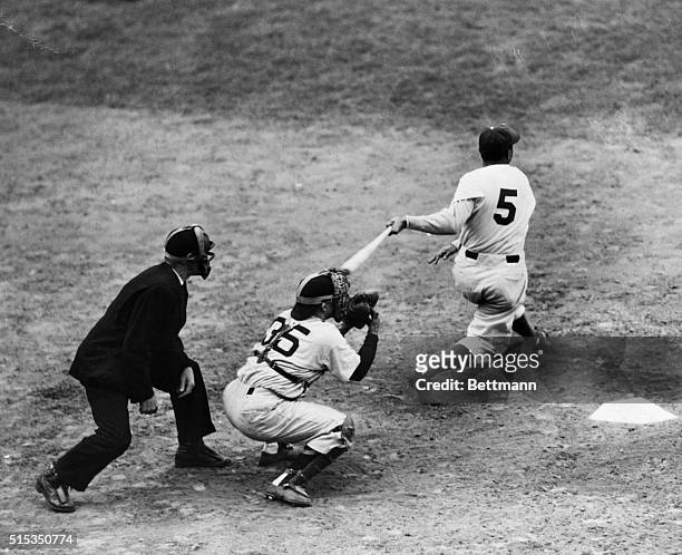 New York, NY: Cookie Lavagetto batting in the winning run with a pinch double in the ninth inning of the fourth World Series game, spoiling Floyd...