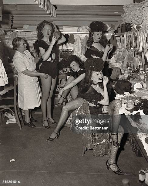 New York, NY- New Year's Eve is just another job for the showgirls at the Diamond Horse-shoe.... Here they are at midnight, getting ready for the...