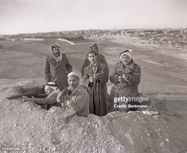 Jerusalem, Palestine-: Right in sight of the Holy City of Jerusalem, which may be seen in background, a group of heavily-armed Arabs poses in a...