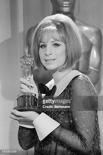 Los Angeles, CA- Barbra Streisand holds her "Oscar" after she was named co-winner of the Best Actress Award in the 41st Annual Academy Awards....