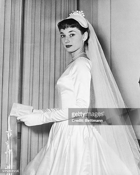 Audrey Hepburn wears the wedding gown designed by Zoe Fontana of Rome for her marriage to James Hanson.
