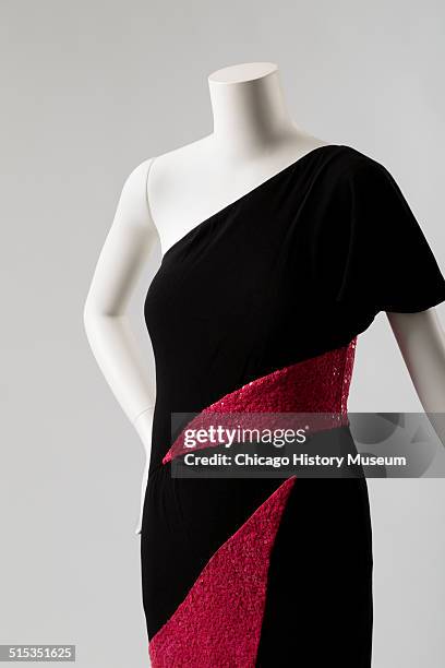 One-shouldered cocktail dress, designed by Karl Lagerfeld for Chloe, with red sequined triangular insets, 1982. Shown as part of the Chicago History...