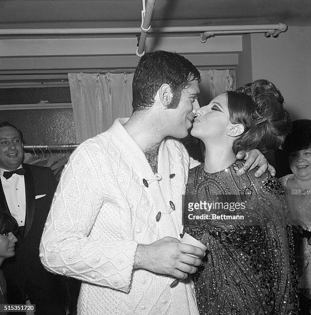 New York, NY- Barbra Streisand, star of Broadway's "Funny Girl," gives her husband, Elliott Gould, a congratulatory kiss after his opening October...