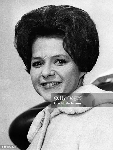 London, England- Breezing to London Airport today from the United States is American teenage disc star Brenda Lee, who is to make some television...