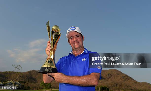 Scott Hend of Australia pictured with the winner's trophy during round four of the True Thailand Classic presented by Chang at Black Mountain Golf...