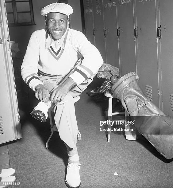 Los Angeles, CA- Bill Spiller, the first Negro to compete in any major golf tournament, puts on his shoes in the locker room of the Riviera country...