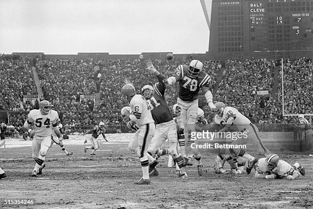 Picture shows pro-football star, Bubba Smith, playing for the Indiana Colts against the Cleveland Browns. Undated photo circa 1960s.