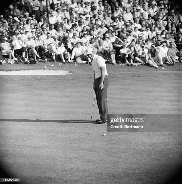 Augusta, GA- Arnold Palmer studies his final putt on the 18th hole of the 72-hole Masters Tournament at the Augusta National Golf Club. Palmer sank...
