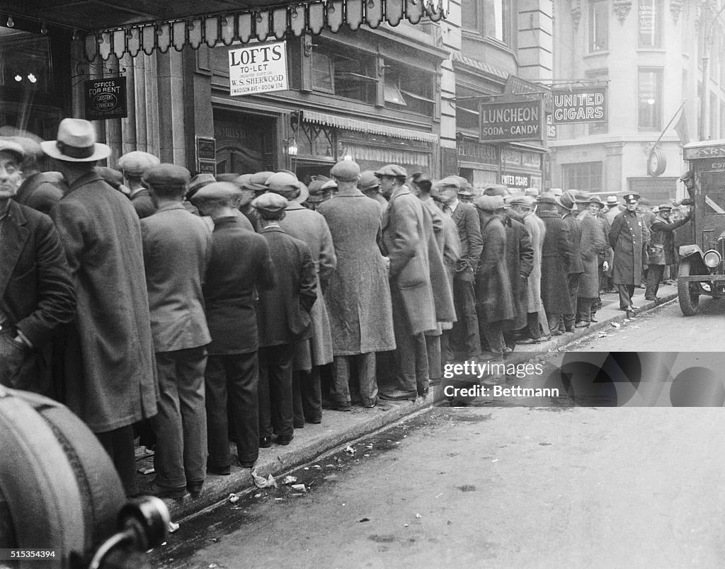 Men Stand On Line On Sidewalk/Nyc