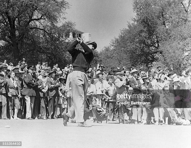 Augusta, GA: "Lord Byron" Nelson, leading in the annual $5,000 Masters' Invitation Golf Tournament, gets off a drive in the 3rd round, as his gallery...