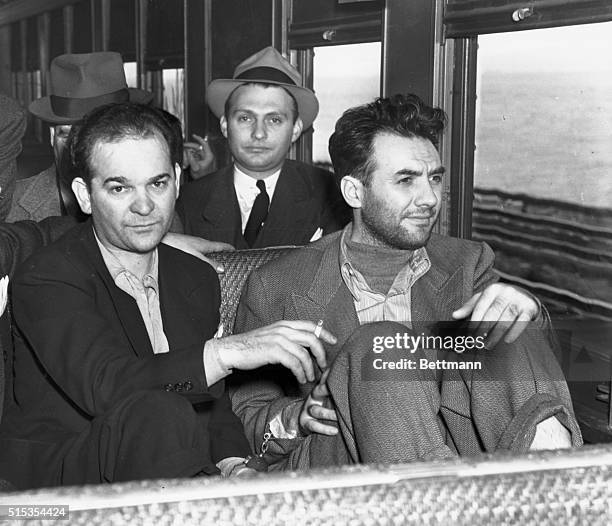 Ossining, NY- Martin Goldstein, leader of the Brooklyn murder syndicate, and Harry Strauss, a co-terrorist, are shown on the train as they neared...