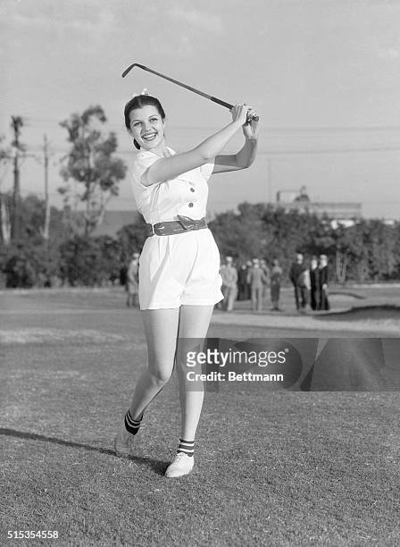 Los Angeles, CA- Rita Cansino of the Hollywood movie set finds that golf is an ideal sport for keeping in trim. She is pictured at the Riviera Club...