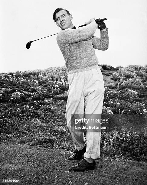 Del Monte, CA- Golfer Clark Gable drives a hard one at Cypress Point, Pebble Beach, California. Dividing his time between golf and fishing, Gable has...